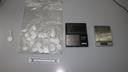Police arrest man for extortion, discover unexpected drug stash