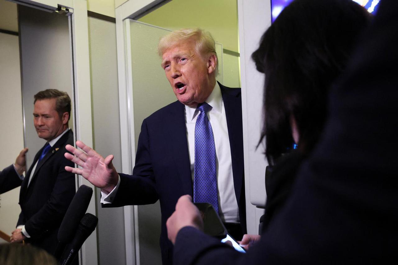 U.S. President Trump speaks to reporters on his return to Washington