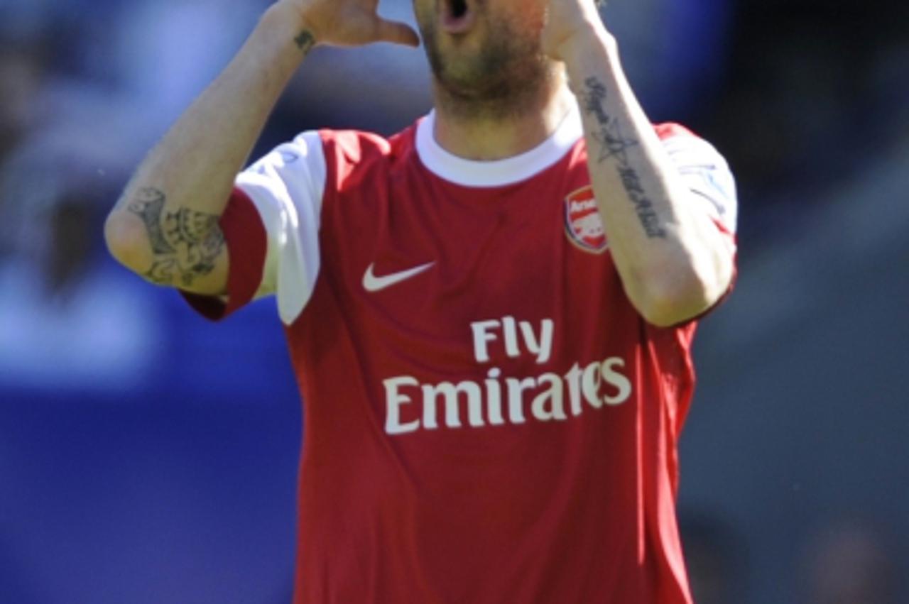 'Arsenal\'s Cesc Fabregas reacts during their English Premier League soccer match against Bolton Wanderers in Bolton, northern England April 24, 2011. REUTERS/Nigel Roddis (BRITAIN - Tags: SPORT SOCCE