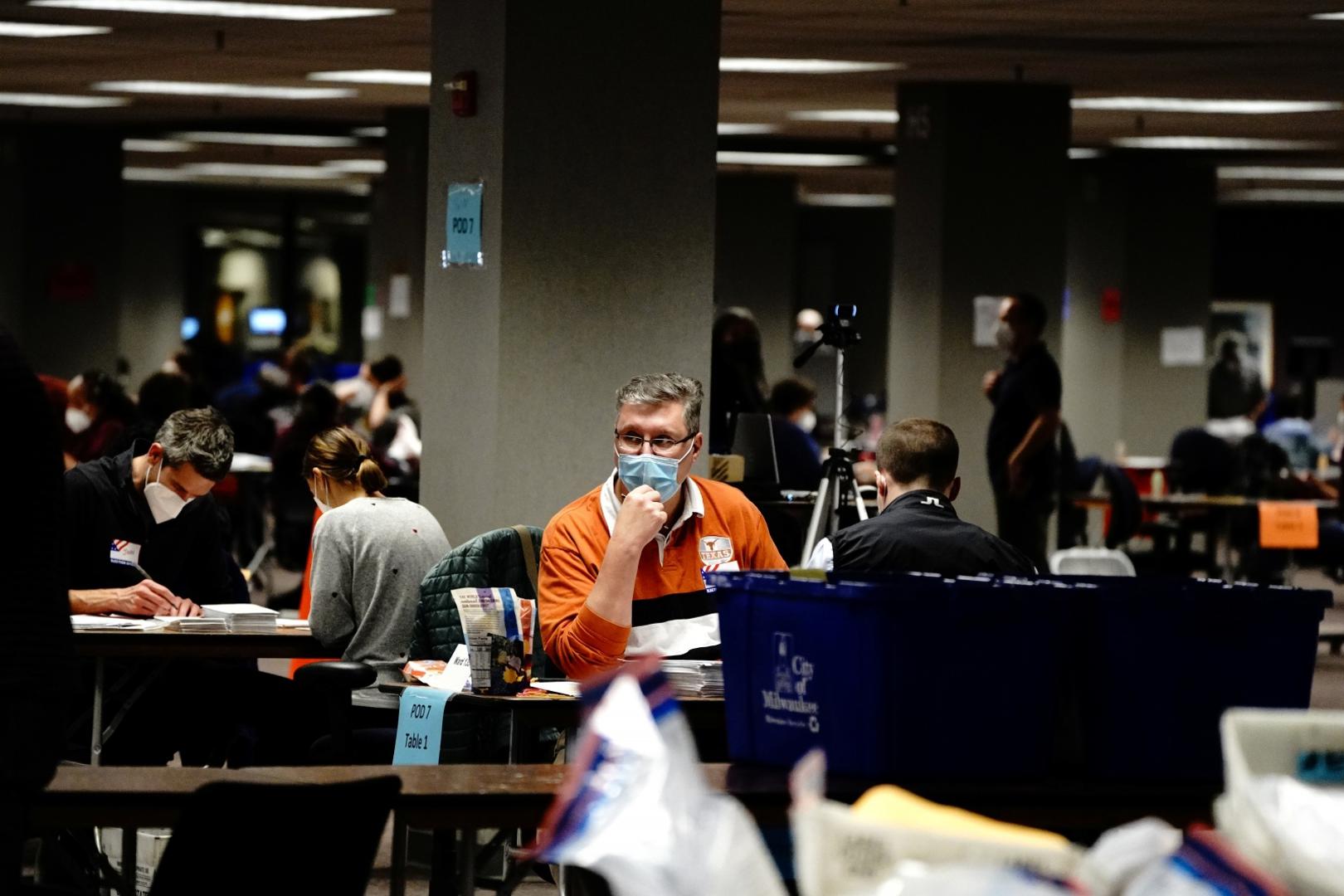 2020 U.S. presidential election in Wisconsin Poll workers process absentee ballots the night of Election Day at Milwaukee Central Count in Milwaukee, Wisconsin, U.S. November 3, 2020. REUTERS/Bing Guan BING GUAN