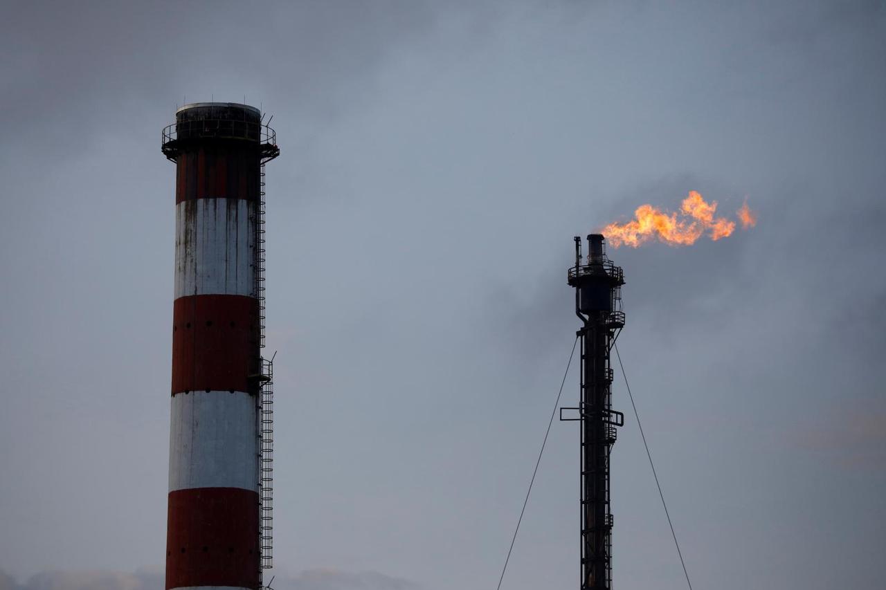 FILE PHOTO: Gas flares from an ExxonMobil oil refinery in Singapore