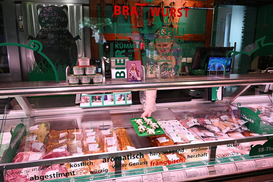 Queen of the White Sausage, Julia Boebel produces the World Cup sausage from her family's butcher shop, shaped like a soccer player, near Rittersbach