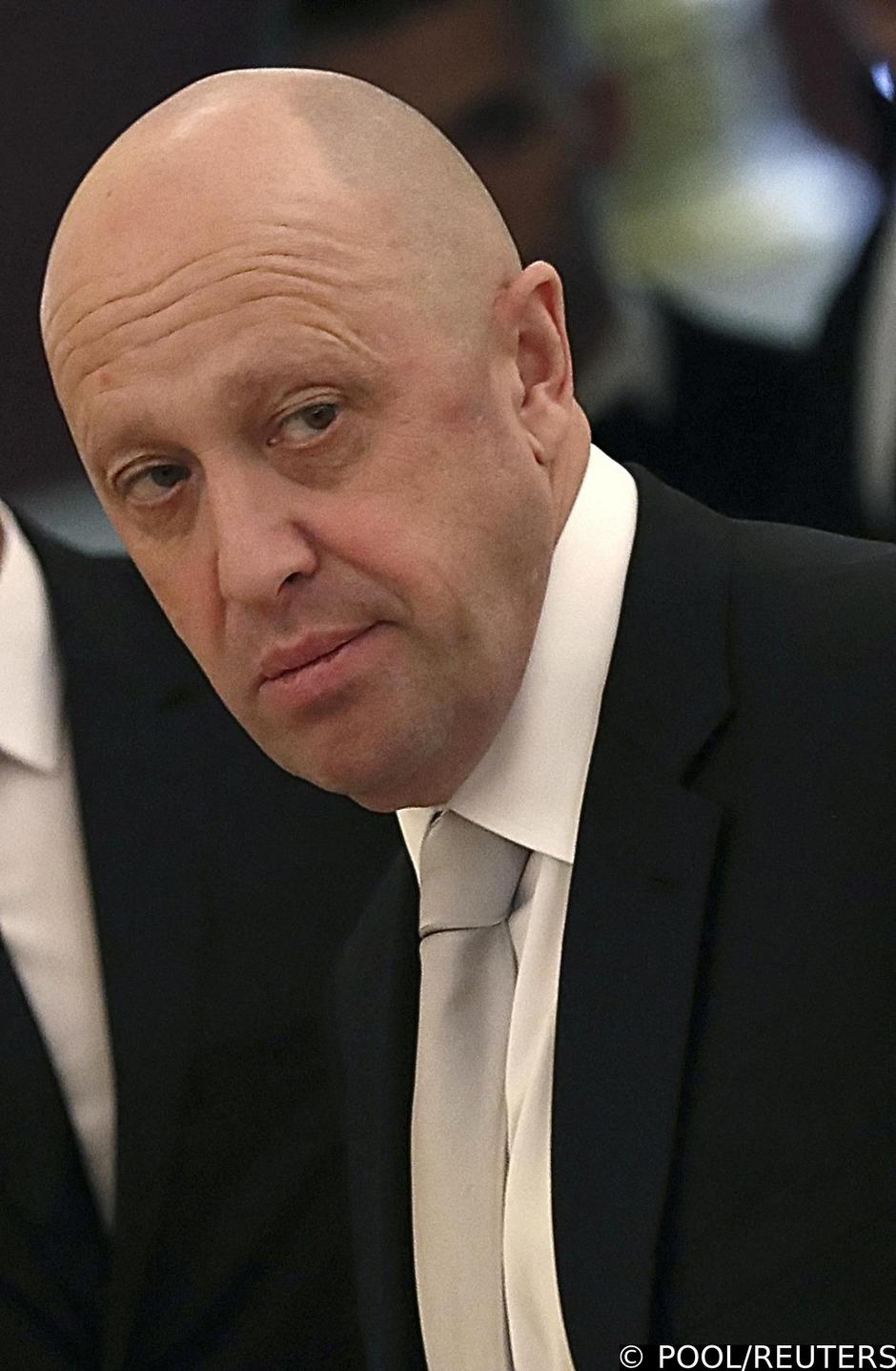 FILE PHOTO: Russian businessman Prigozhin looks on before a meeting at the Kremlin in Moscow