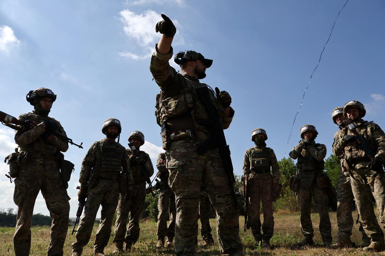Ukrainian service members attend a military drill near a frontline, in Zaporizhzhia region