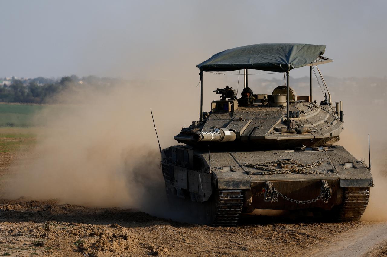 A tank manoeuvres near the Israel-Gaza border