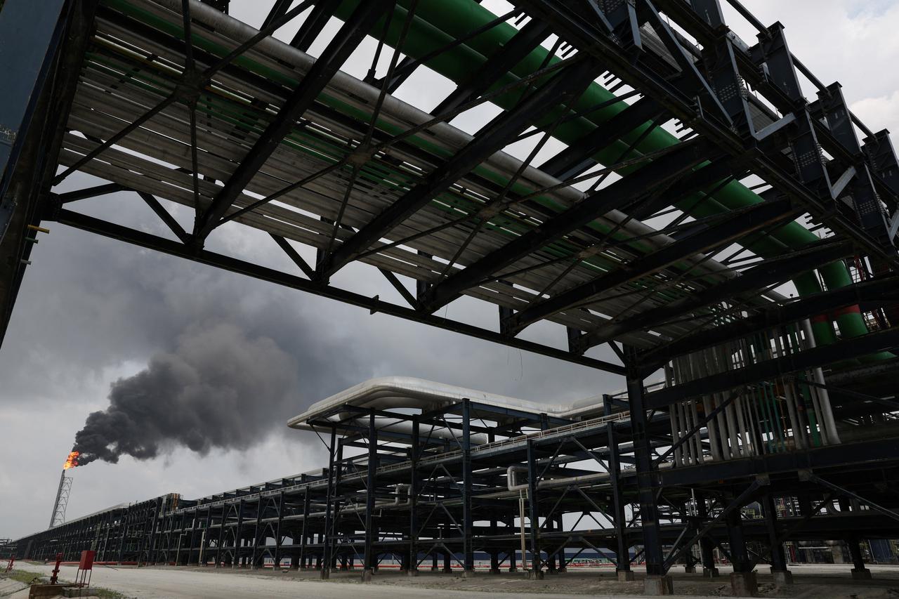 A flame rises from a gas flare at the Dangote refinery refinery in Lagos, Nigeria