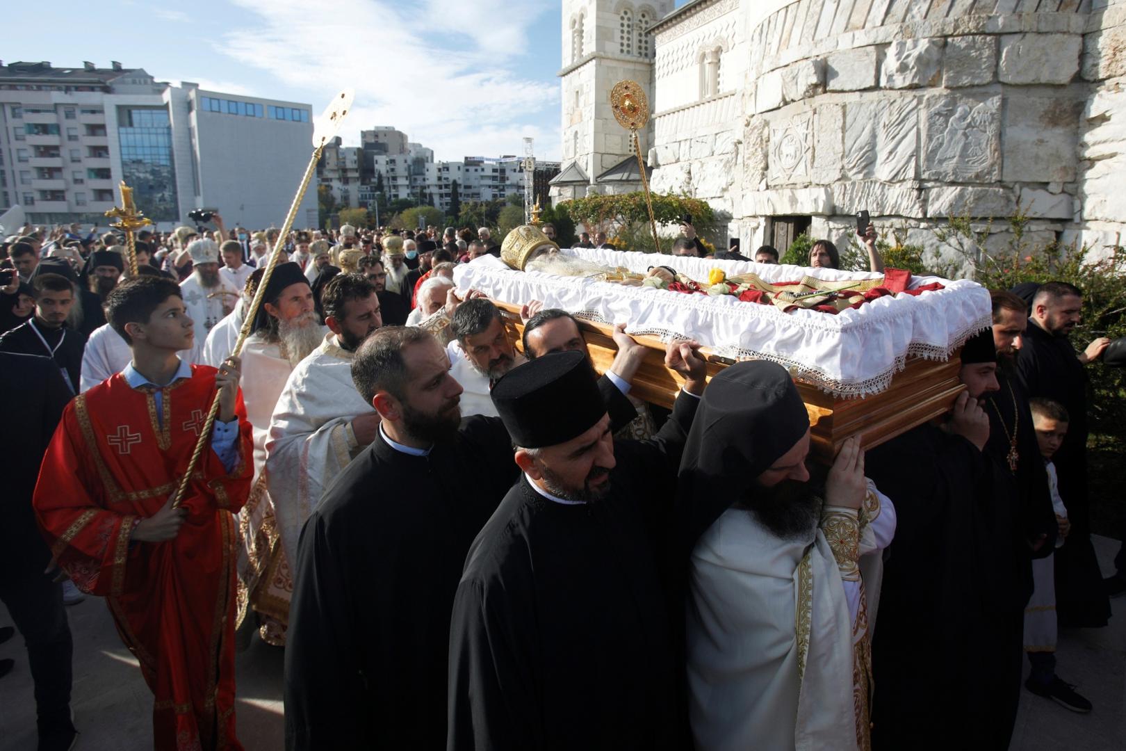 Priests carry the coffin of Metropolitan Amfilohije Radovic in Podgorica Priests carry the coffin of Metropolitan Amfilohije Radovic, the top cleric of the Serbian Orthodox Church in Montenegro who died from the coronavirus disease (COVID-19), around Cathedrall of Christ Ressurection during his funeral in Podgorica, Montenegro, November 1, 2020. REUTERS/Stevo Vasiljevic STEVO VASILJEVIC