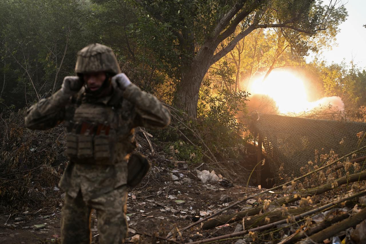 Ukrainian servicemen fire a self-propelled howitzer towards Russian troops near the city of Kostiantynivka