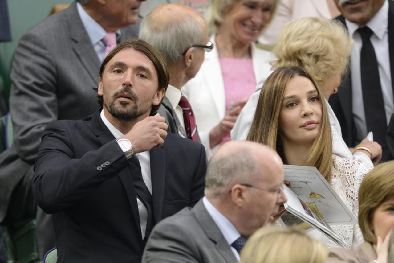 'Former Croatian tennis player Goran Ivanisevic and his wife Tatjana (R) in the Royal Box before the men\'s singles semi-final between Serbia\'s Novak Djokovic and Switzerland\'s Roger Federer on day 