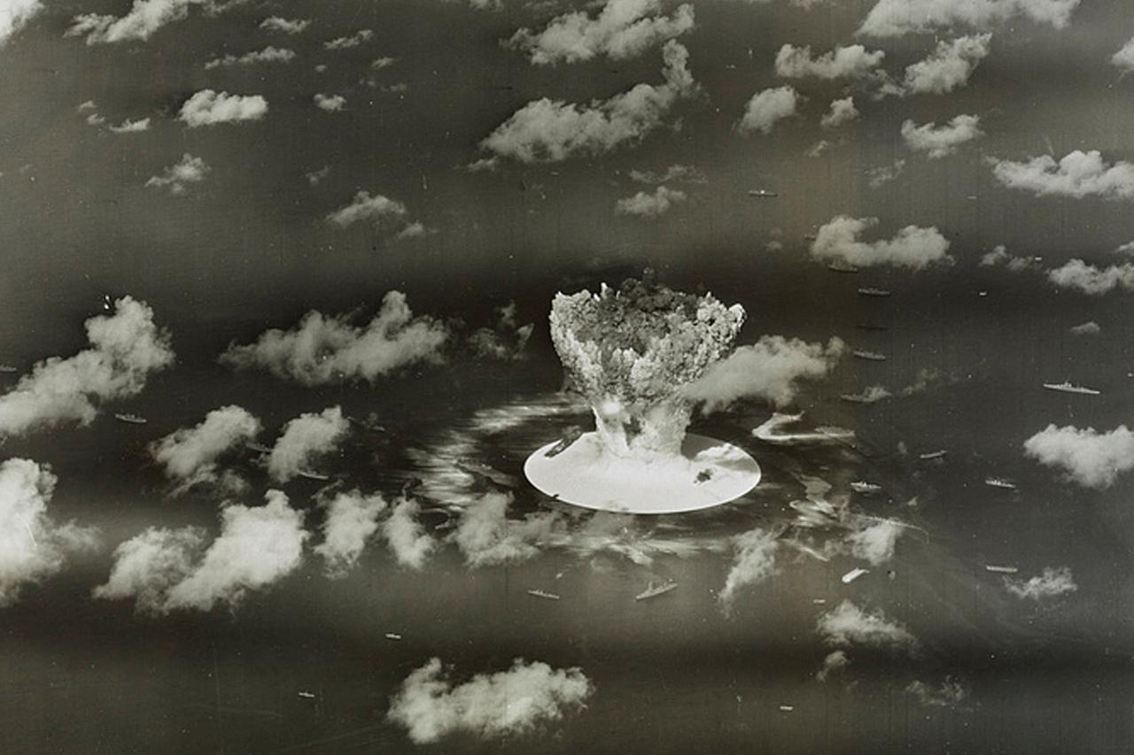 FILE PHOTO: Handout of a mushroom cloud rises with ships below during Operation Crossroads nuclear weapons test on Bikini Atoll