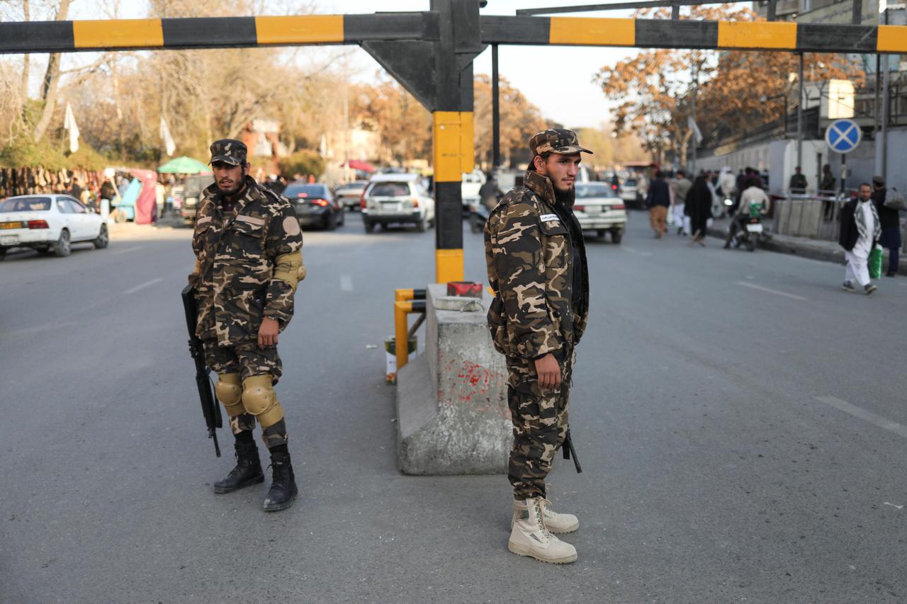 Taliban fighters guard a street in Kabul