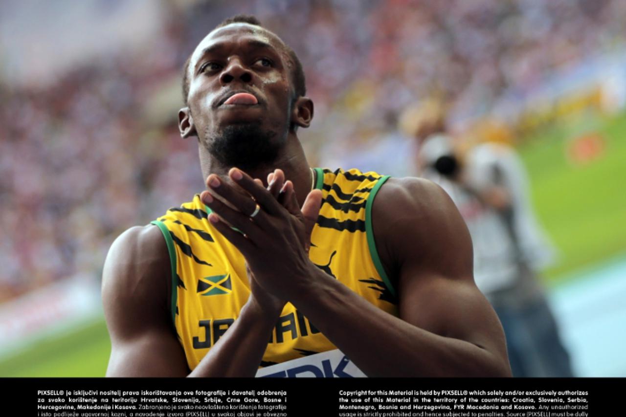 'Usain Bolt of Jamaica reacts after the Men\'s 4x100m Relay Final at the 14th IAAF World Championships in Athletics at Luzhniki Stadium in Moscow, Russia, 18 August 2013. Photo: Michael Kappeler/dpa +