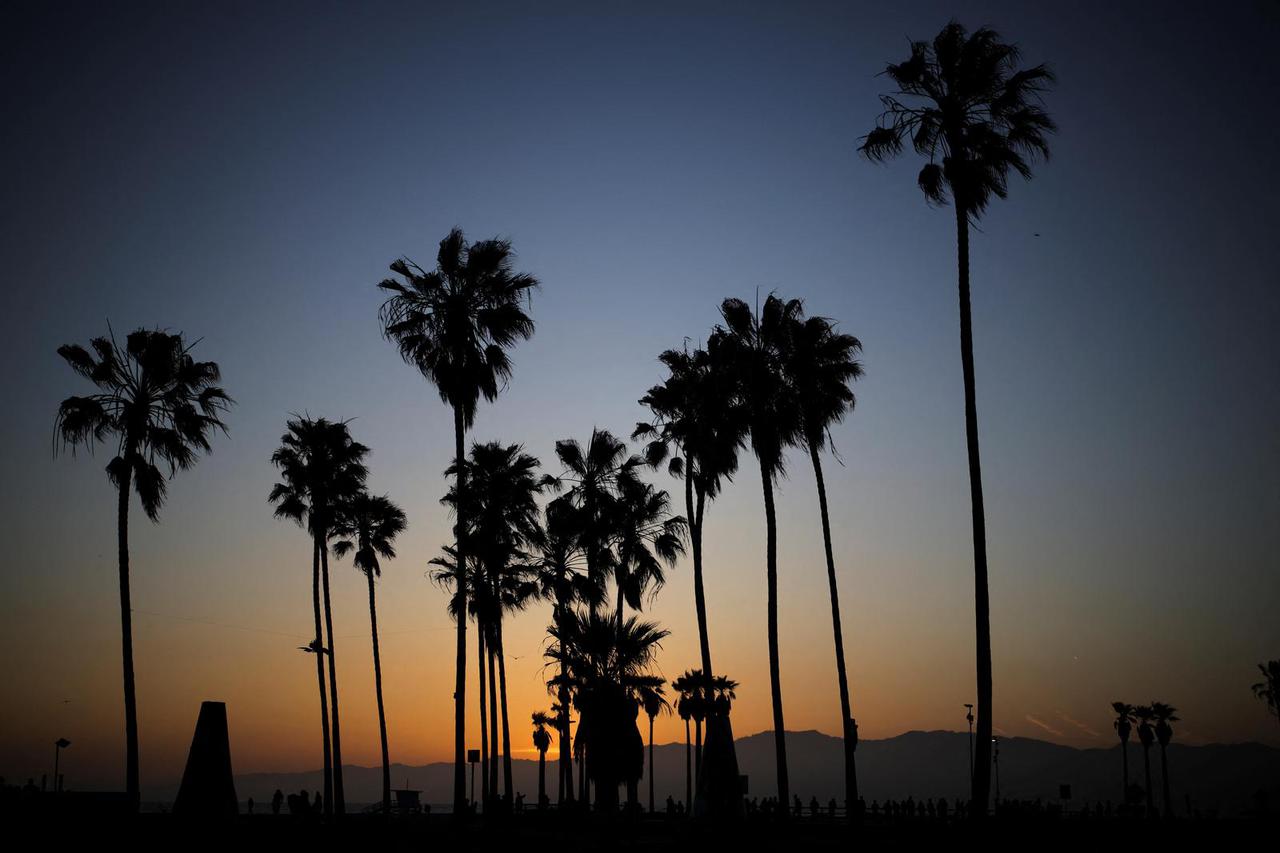 The sun sets over Venice Beach in Los Angeles