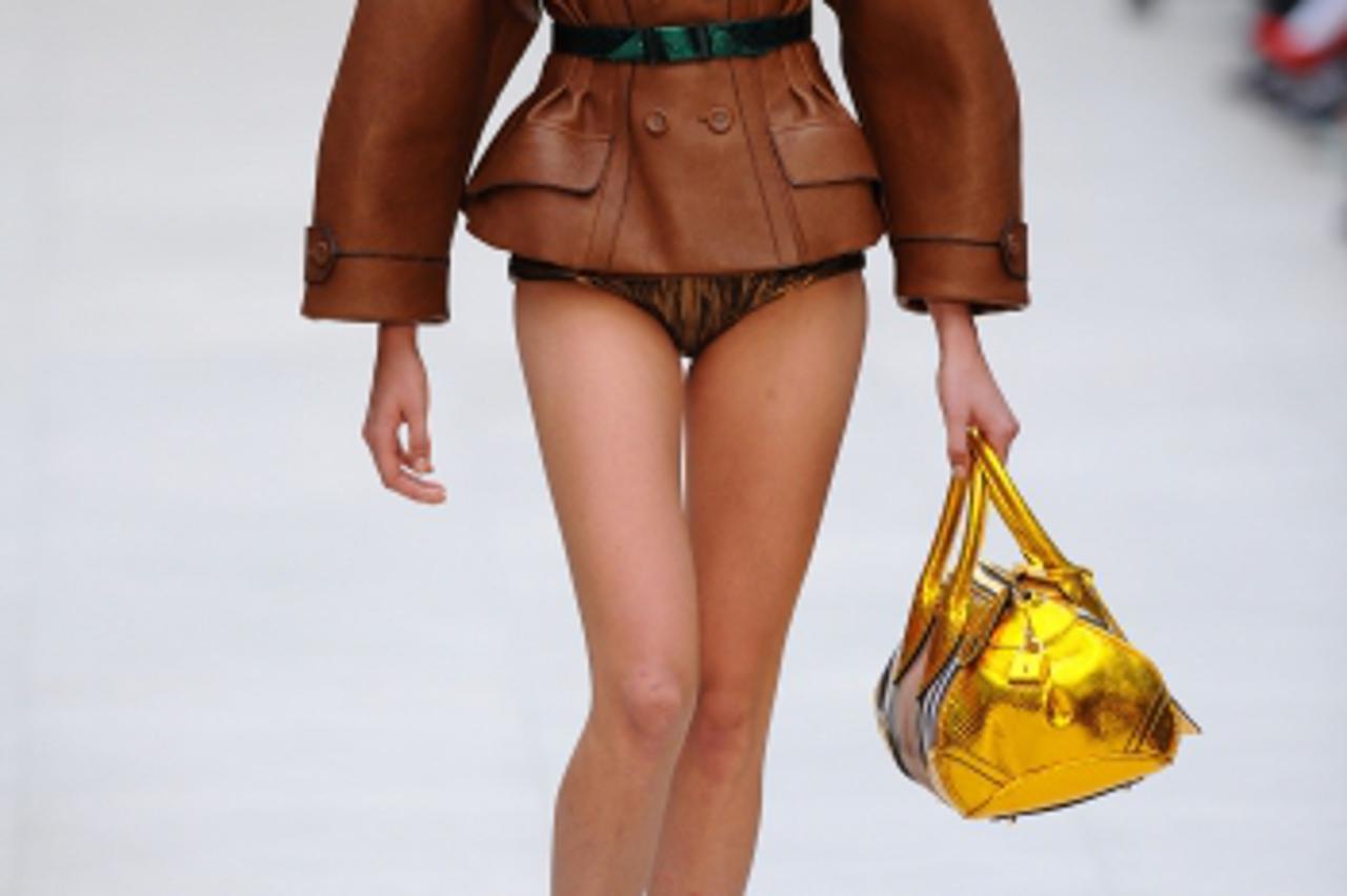 'Model Cara Delevigne on the catwalk during the Burberry fashion show, held in Hyde Park as part of London Fashion Week.Photo: Press Association/PIXSELL'