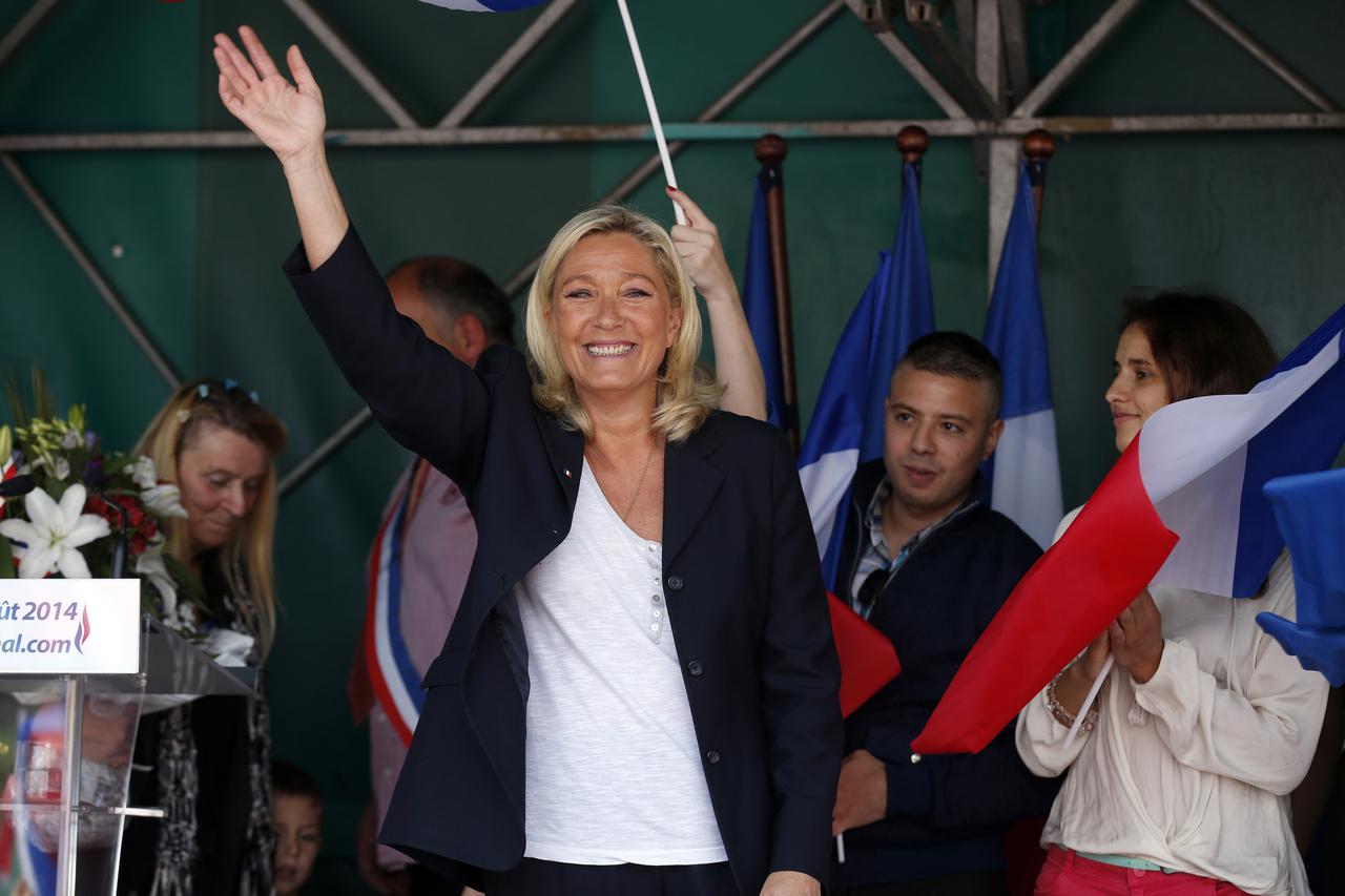Marine Le Pen, France's National Front political party leader, waves at the end of a political rally in Brachay northern France, August 30, 2014. REUTERS/Benoit Tessier (FRANCE - Tags: POLITICS)