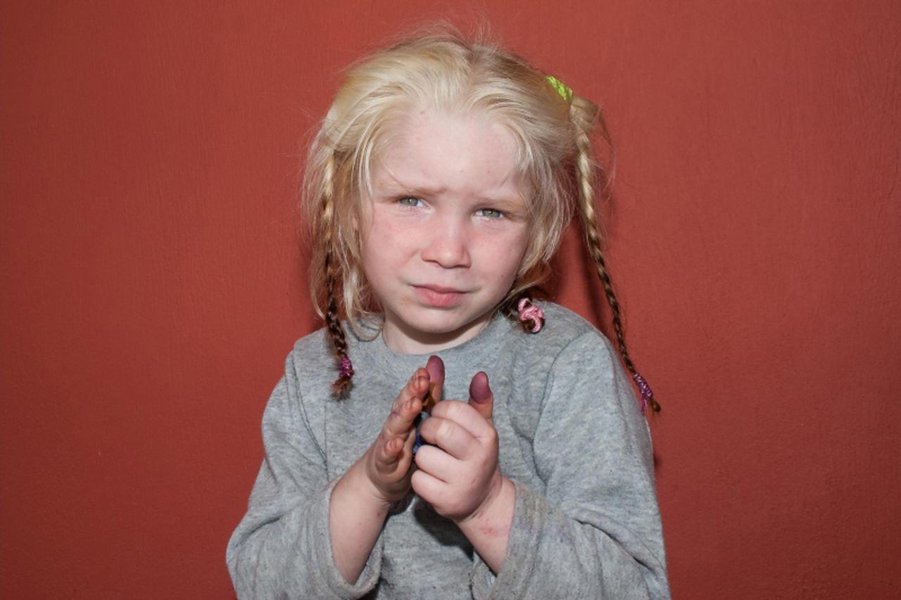 'A four-year-old girl, found living with a Roma couple in central Greece, is seen in a handout photo distributed by the Greek police and obtained by Reuters October 18, 2013. Greek police are investig