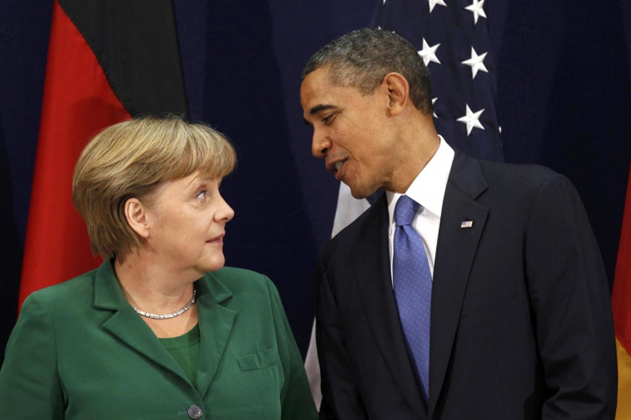 'German Chancellor Angela Merkel meets U.S. President Barack Obama at the G20 Summit in Cannes in this November 3, 2011 file photo. To match Special Report GERMANY-MERKEL/ REUTERS/Kevin Lamarque/Files