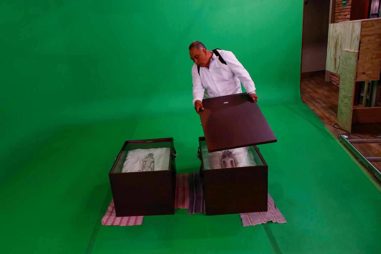 Mexican journalist and UFO enthusiast Jaime Maussan shows bodies he presented to Mexico's Congress, in Mexico City