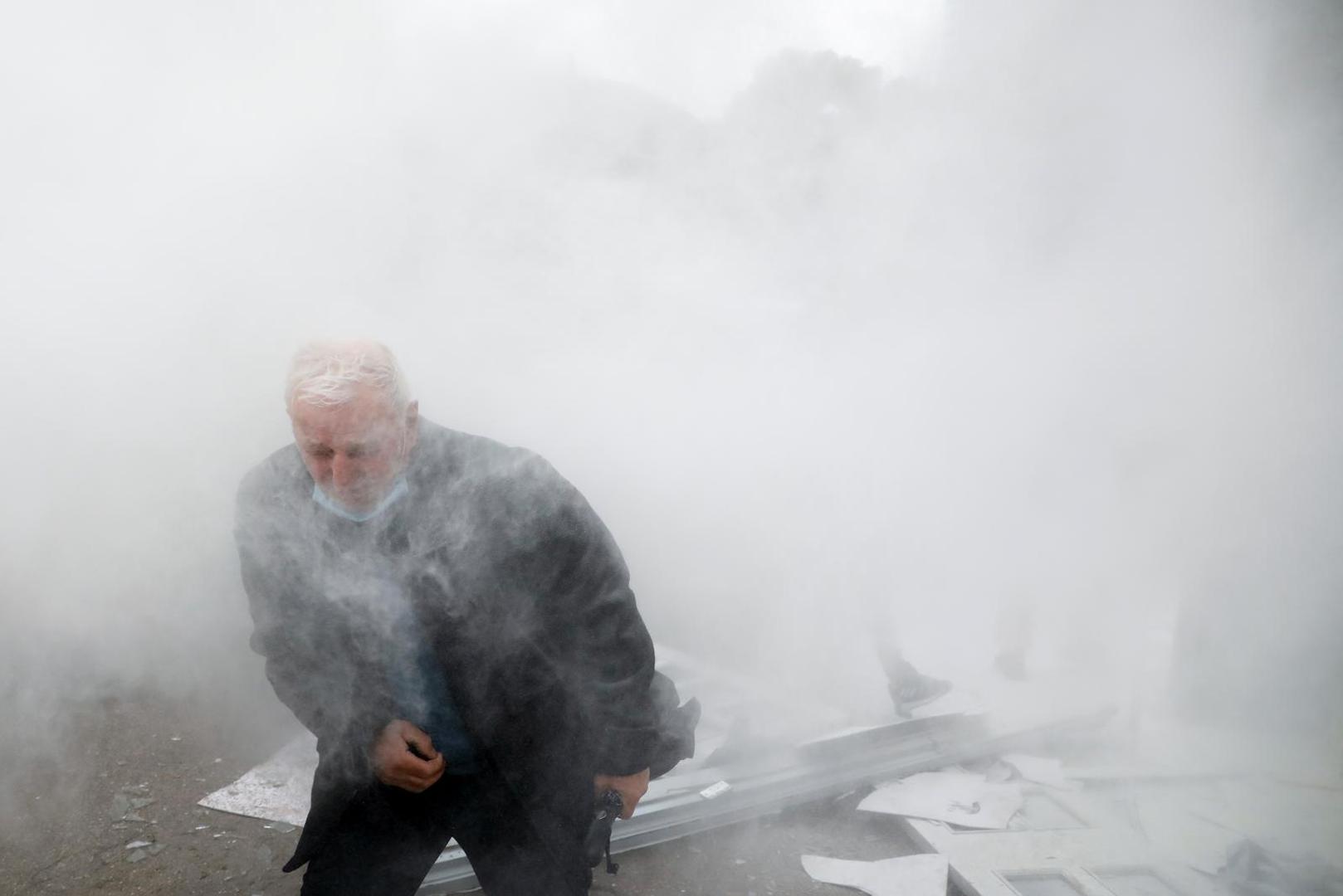 A man reacts as protesters demonstrate outside the headquarters of the Democratic Party in Tirana, Albania, January 8, 2022. REUTERS/Florion Goga Photo: Florion Goga/REUTERS