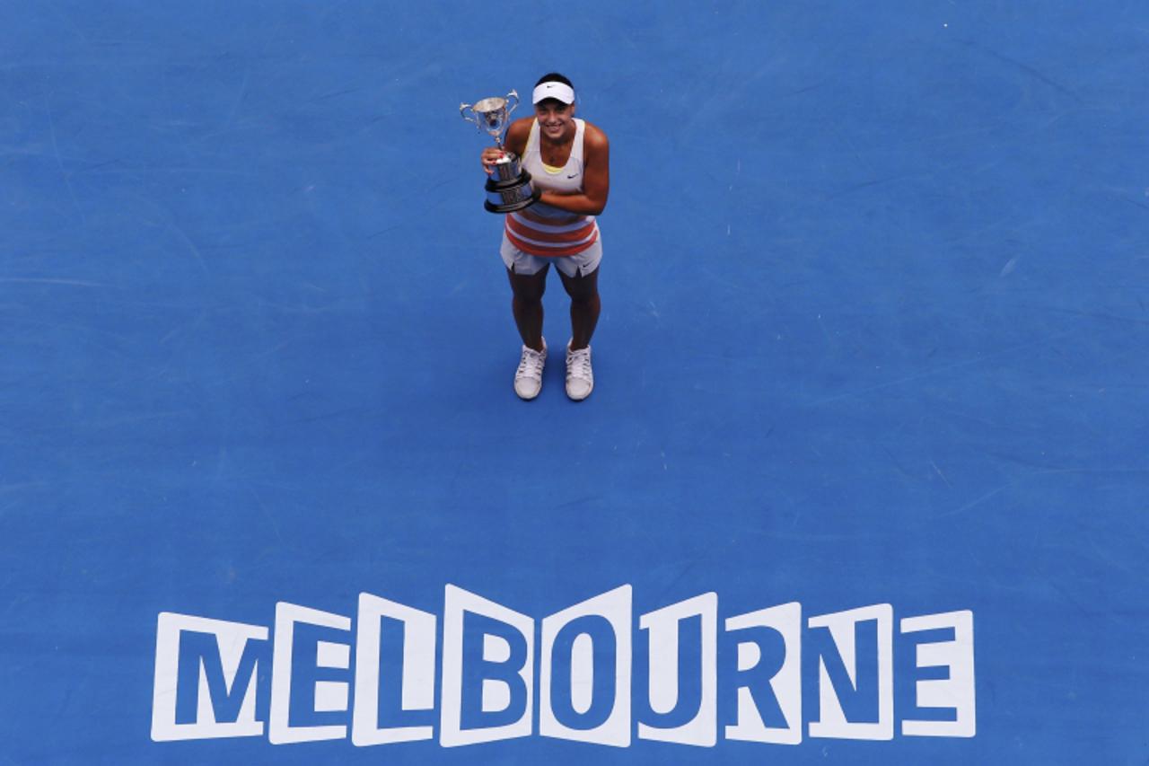 'Ana Konjuh of Croatia poses with the trophy after winning the junior girls\' singles final match against Katerina Siniakova of Czech Republic at the Australian Open tennis tournament in Melbourne Jan