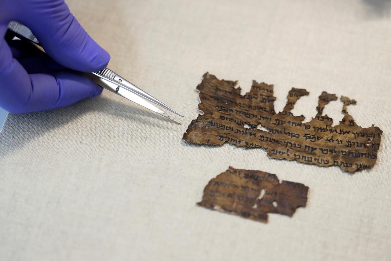 Fragments from the Dead Sea Scrolls that underwent genetic sampling to shed light on the 2,000-year-old biblical trove are shown to Reuters at the Israel Antiquities Authority laboratory in Jerusalem
