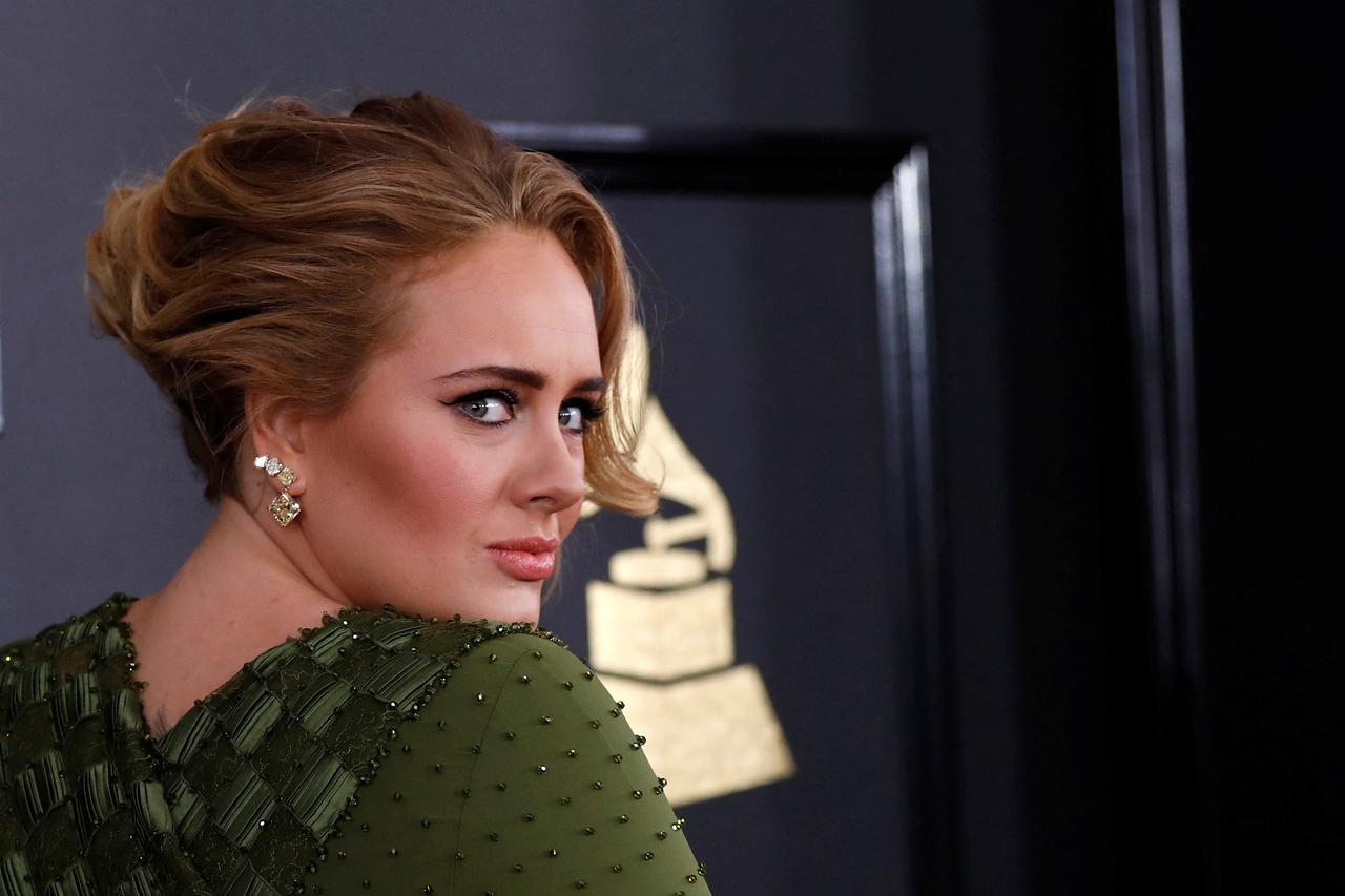 FILE PHOTO: Singer Adele arrives at the 59th Annual Grammy Awards in Los Angeles