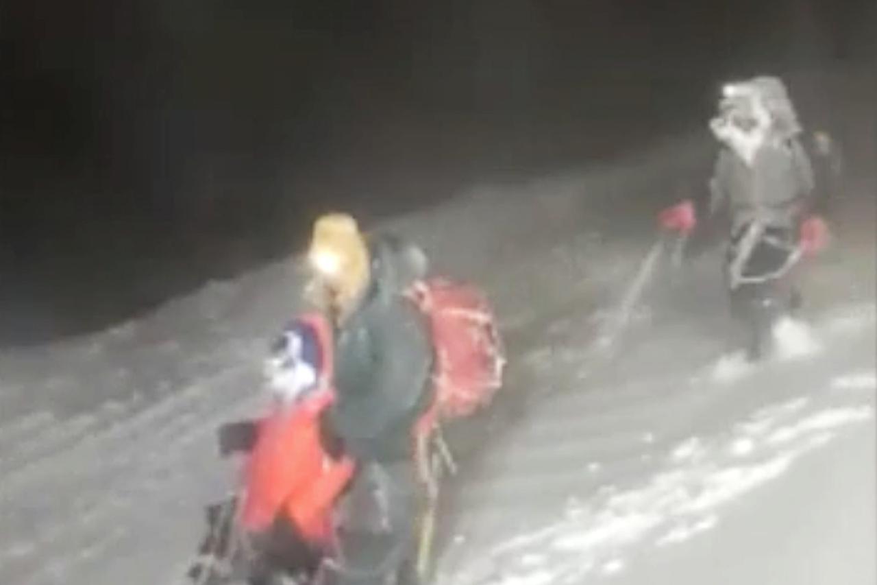 Members of Russia's Emergencies Ministry conduct a rescue operation on the slope of Mount Elbrus