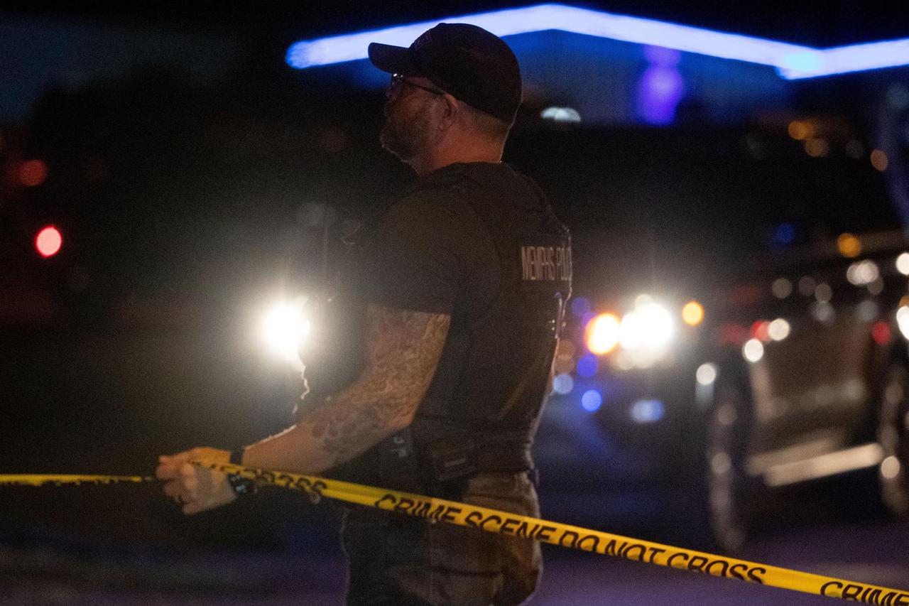 Memphis police officers work the scene where police arrested 19-year-old Ezekiel Kelly