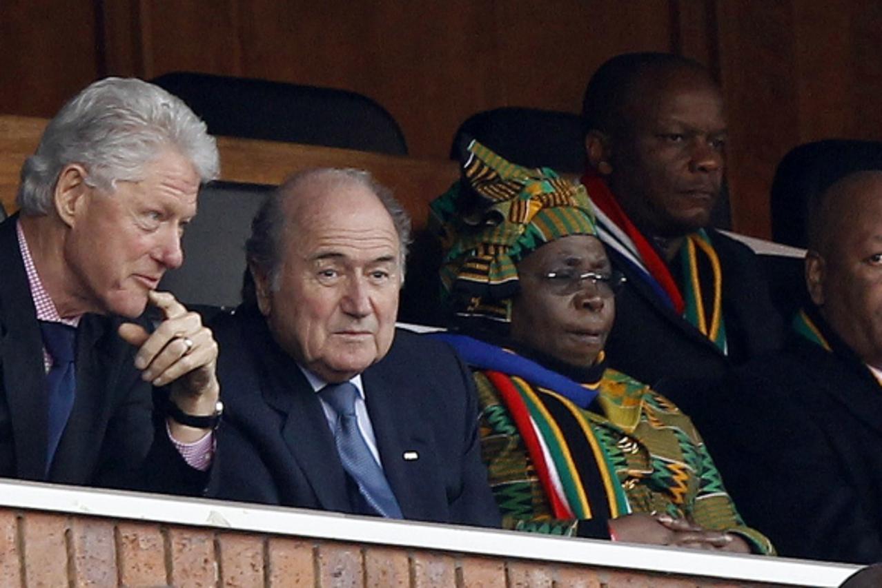 'Former U.S. President Bill Clinton (L) and FIFA President Sepp Blatter (2nd L) attend the 2010 World Cup Group C soccer match between the United States and Algeria at Loftus Versfeld stadium in Preto