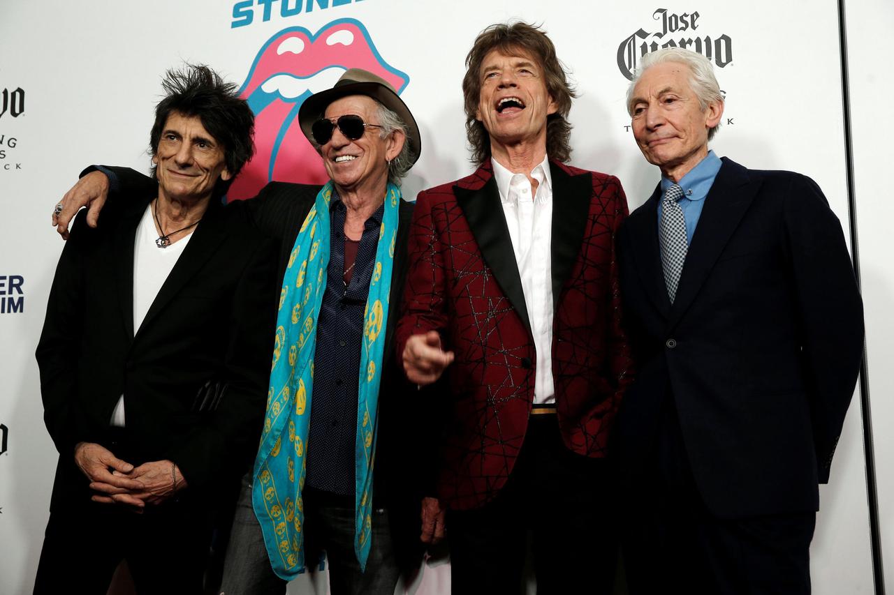 The Rolling Stones pose as they arrive for the opening of the new exhibit 