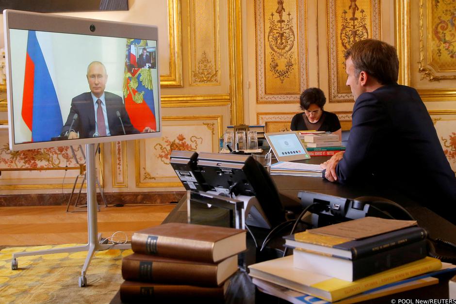 FILE PHOTO: French President Emmanuel Macron holds a video meeting with Russian President Vladimir Putin