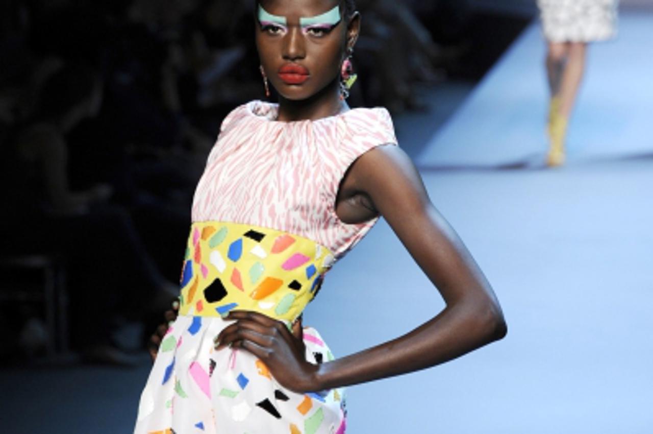 'A model presents a creation for French house Dior during Haute Couture Fall-Winter 2011/2012 fashion show in Paris July 4, 2011.  REUTERS/Gonzalo Fuentes  (FRANCE - Tags: FASHION)'