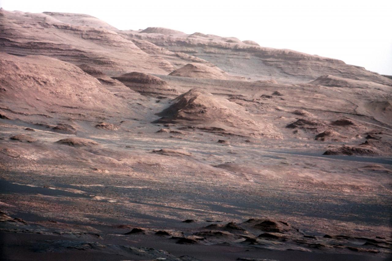 'The base of Mars\' Mount Sharp -  the rover\'s eventual science destination  -  is pictured in this August 27, 2012 NASA handout photo taken by the Curiosity rover. The image is a portion of a larger