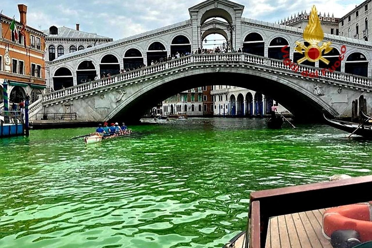 Venice's waters turn green due to an unknown substance near the Rialto Bridge