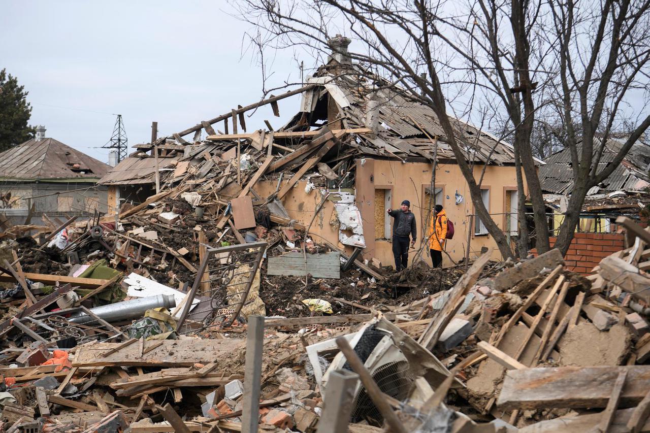 FILE PHOTO: A rescuer walks during a search operation for bodies under the rubble of a building destroyed by Russian shelling, amid Russia's Invasion of Ukraine, in Borodyanka