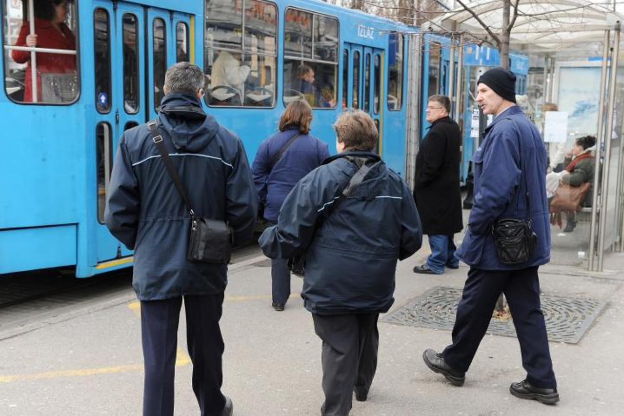 '10.01.2013., Zagreb -  Reportaza o kontrolorima ZET-a. Kontrolori Zeljko Marinovic i Davor Guja pregledavali su karte putnika u tramvajima.  Photo: Davor Visnjic/PIXSELL'