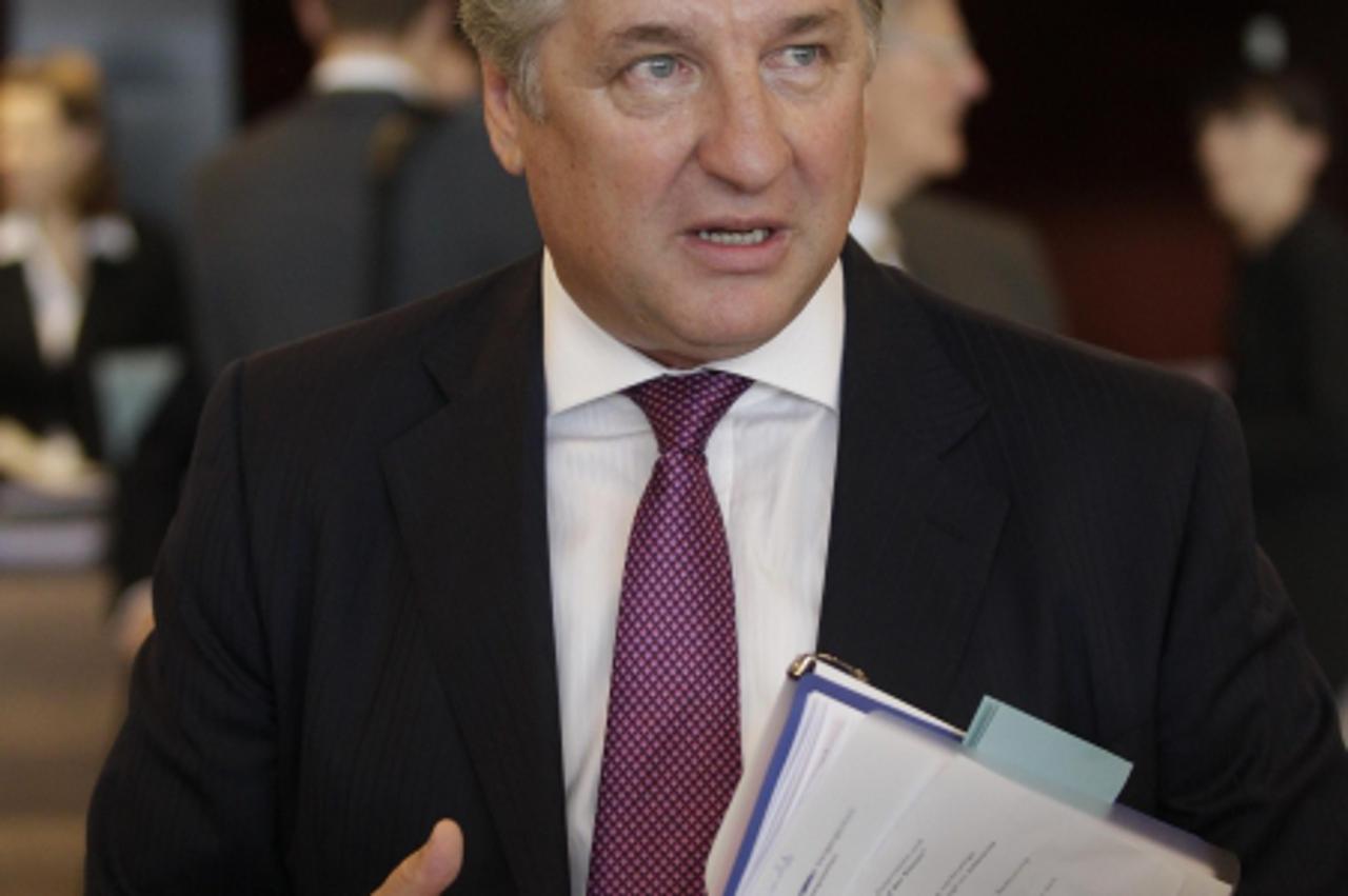 'Telekom Austria shareholder Ronny Pecik talks to journalists upon his arrival at the Telekom Austria\'s annual shareholders meeting in Vienna May 23. 2012. Pecik said he would for now refrain from ra
