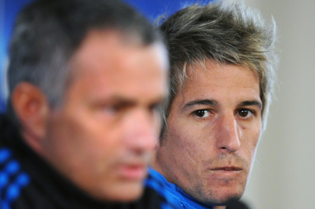 'Head Coach Jose Mourinho (L) and Fabio Coentrao of Real Madrid attend a press conference in Moscow on February 20, 2012, prior their round of 16, first leg UEFA Champions League match against CSKA Mo