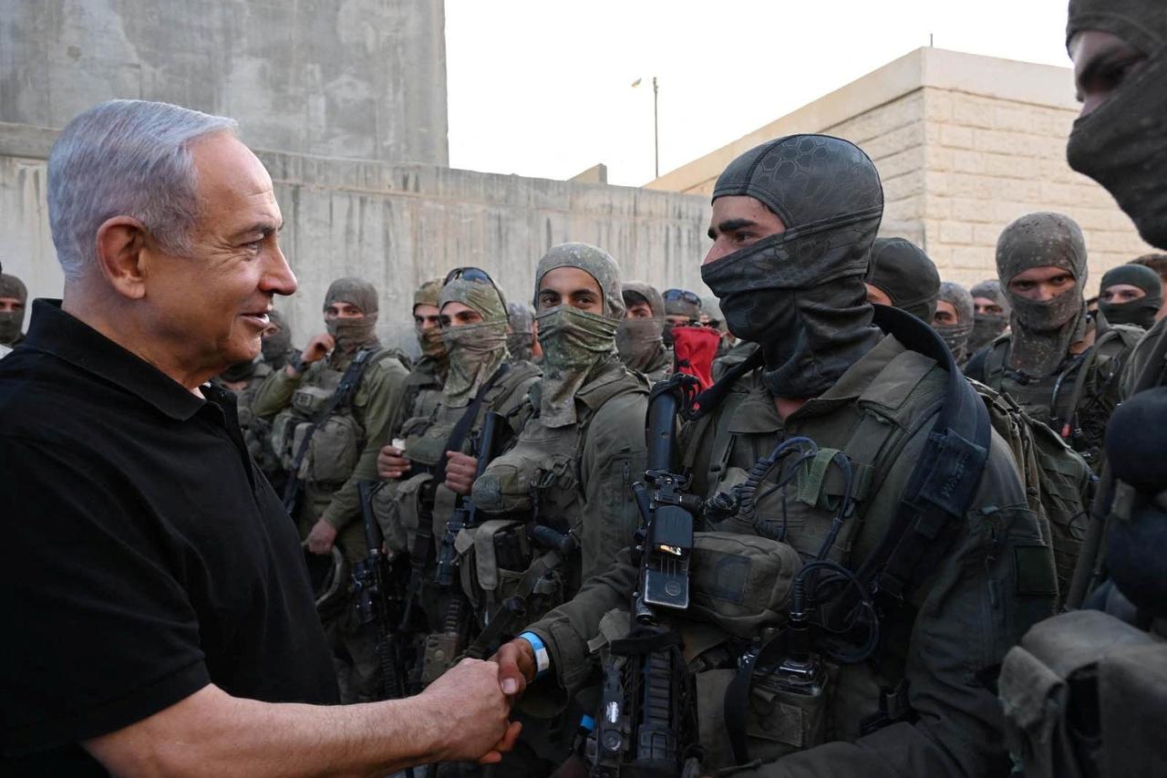 Israeli Prime Minister Benjamin Netanyahu meets with soldiers in Tze'elim