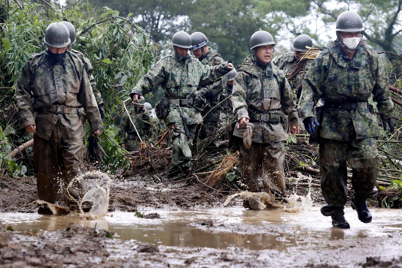 Japanese Self-Defence Force soldiers conduct search and rescue operation at a landslide site caused by Typhoon Nanmadol in Mimata Town