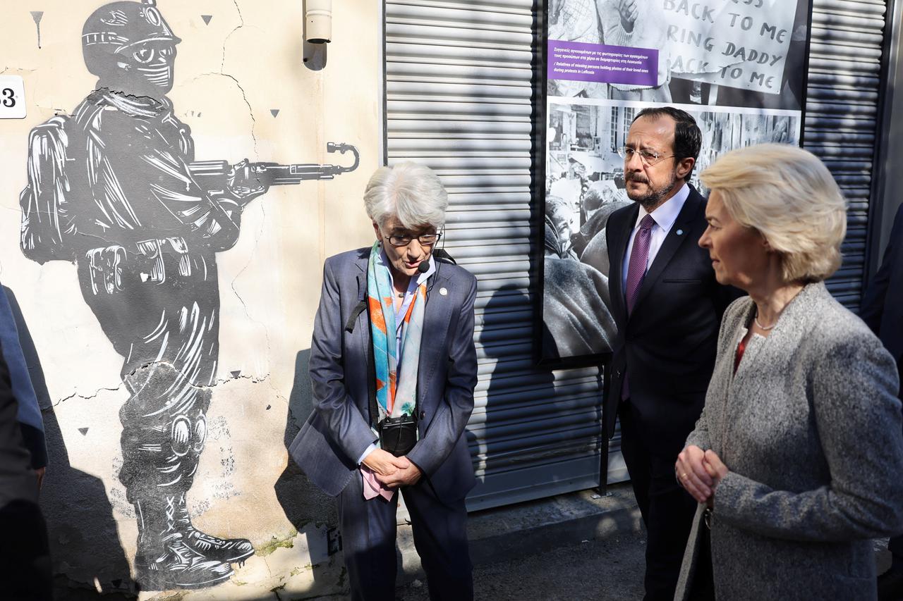 Cyprus' President Nikos Christodoulides and European Commission President Ursula von der Leyen talk during a tour along the UN-controlled buffer zone in Nicosia