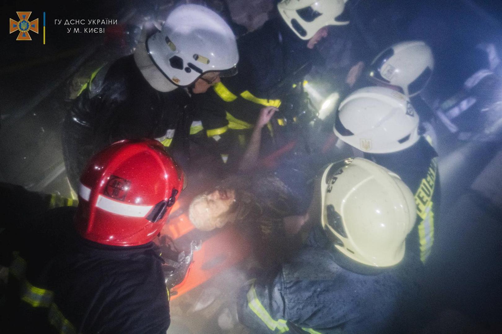 SENSITIVE MATERIAL. THIS IMAGE MAY OFFEND OR DISTURB Rescuers release a man from under the debris inside a shopping mall damaged by an airstrike, as Russia's attack on Ukraine continues, in Kyiv, Ukraine, in this handout picture released March 21, 2022.  Press service of the State Emergency Service of Ukraine/Handout via REUTERS ATTENTION EDITORS - THIS IMAGE HAS BEEN SUPPLIED BY A THIRD PARTY. Photo: State Emergency Service/REUTERS