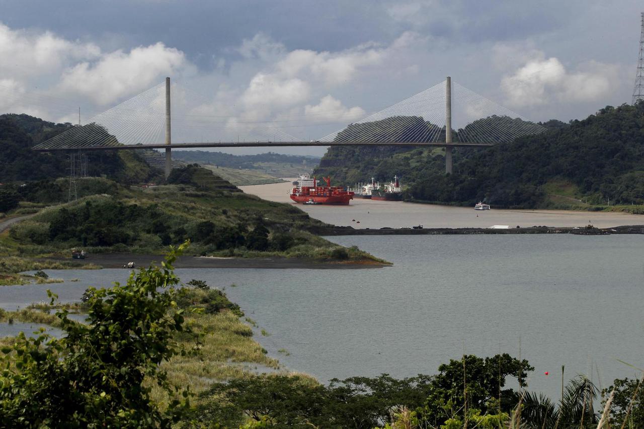 FILE PHOTO: Cargo boat navigates on the Panama Canal next to the expansion project of the Panama Canal on the pacific side in Panama City