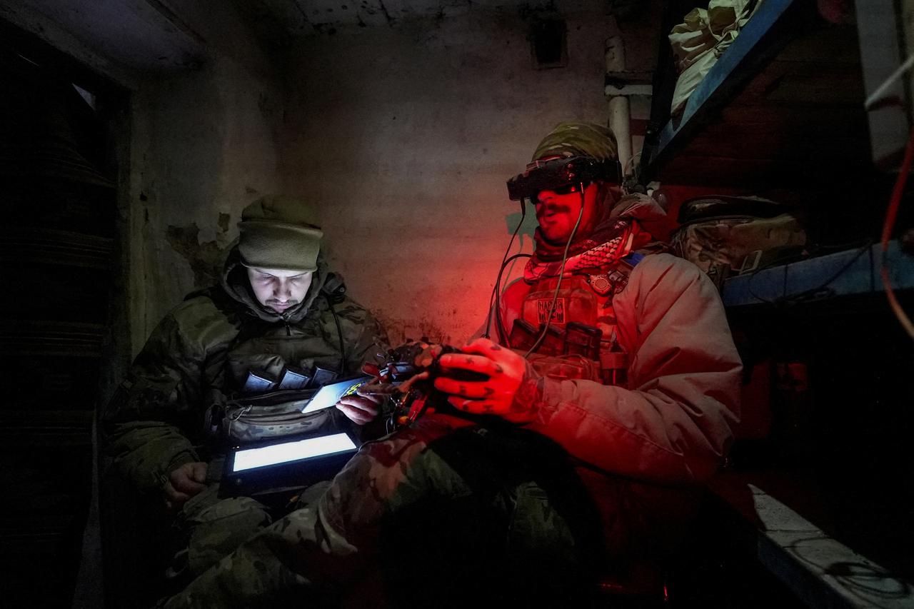 Ukrainian servicemen operate a first person view (FPV) drone at a position near the town of Horlivka