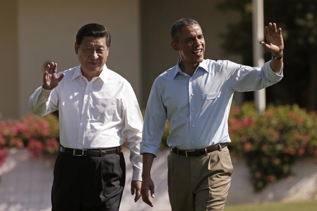 'U.S. President Barack Obama and Chinese President Xi Jinping walk the grounds at The Annenberg Retreat at Sunnylands in Rancho Mirage, California June 8, 2013  The two-day talks at a desert retreat n