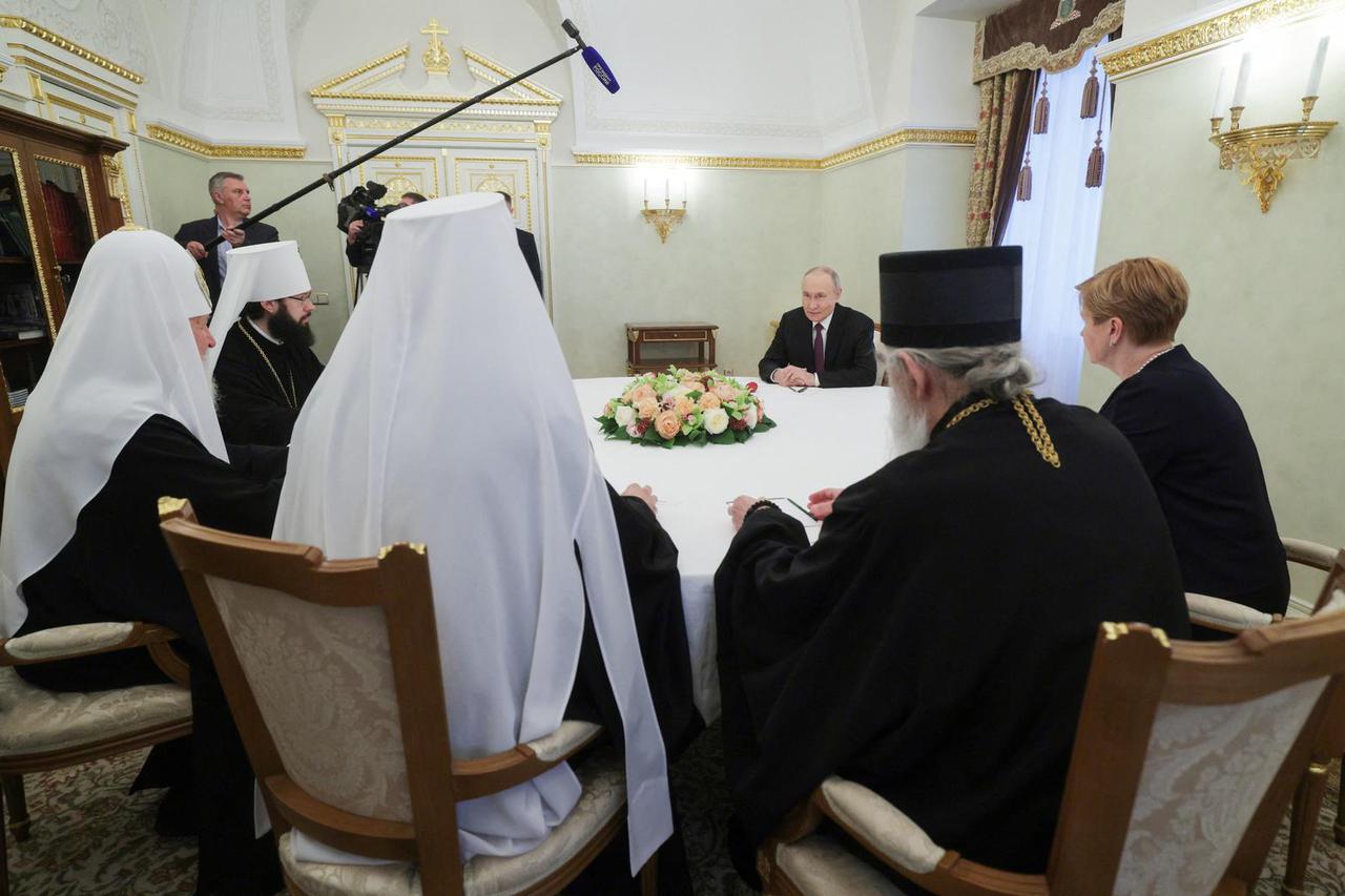 Russian President Vladimir Putin welcomes Serbian Patriarch Porfirije in Moscow