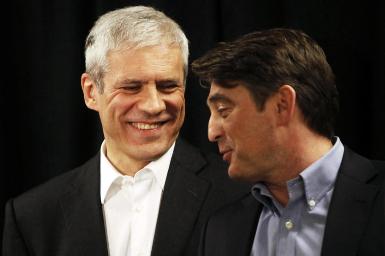 'Members of the Bosnian tripartite presidency Zeljko Komsic (R) and Serbia\'s President Boris Tadic speaks before a news conference after a meeting on Jahorina mountain near Sarajevo February 3, 2012.