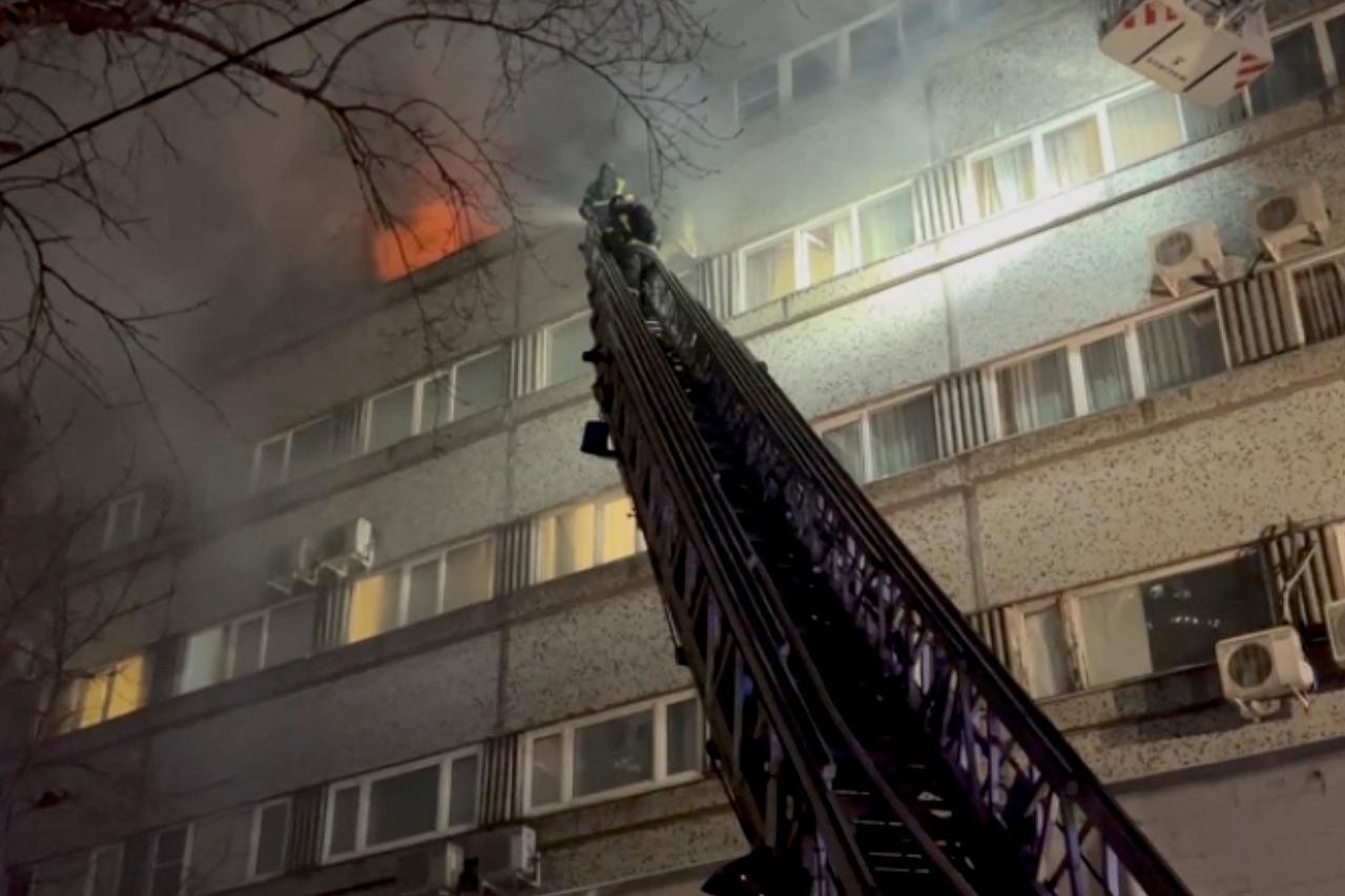 Firefighters put out a fire in the building which houses the MKM hotel in Moscow