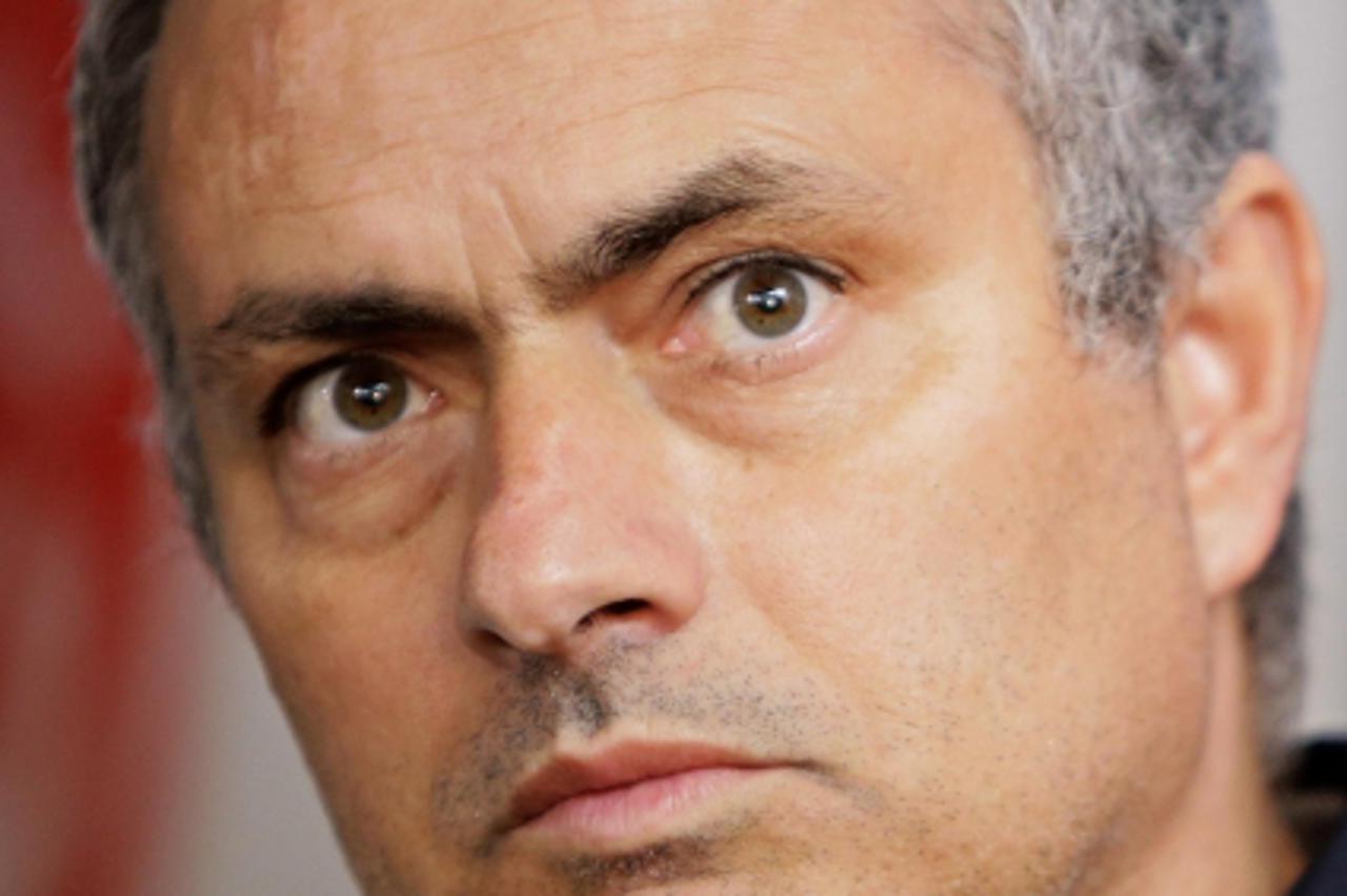 'Real Madrid coach Jose Mourinho listens to a question during a news conference in Singapore June 14, 2012. Holders Spain remain the team to beat at Euro 2012 despite their sluggish start against Ital