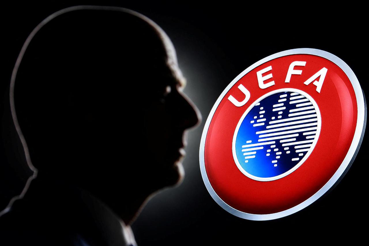 Illustration shows a silhouette of FIFA President Gianni Infantino is seen next to the UEFA logo